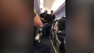 Video shows a passenger forcibly dragged off a United Airlines plane [upl. by Noret]